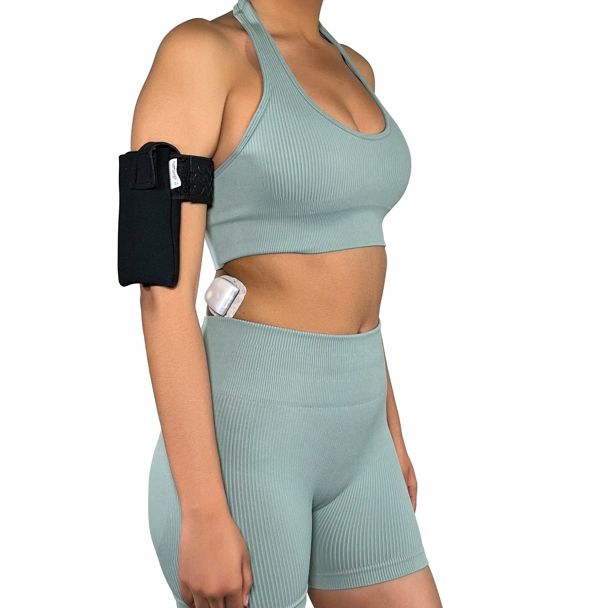A woman wearing a Pumpcases Omnipod 5 PDM black armband case on a white background.