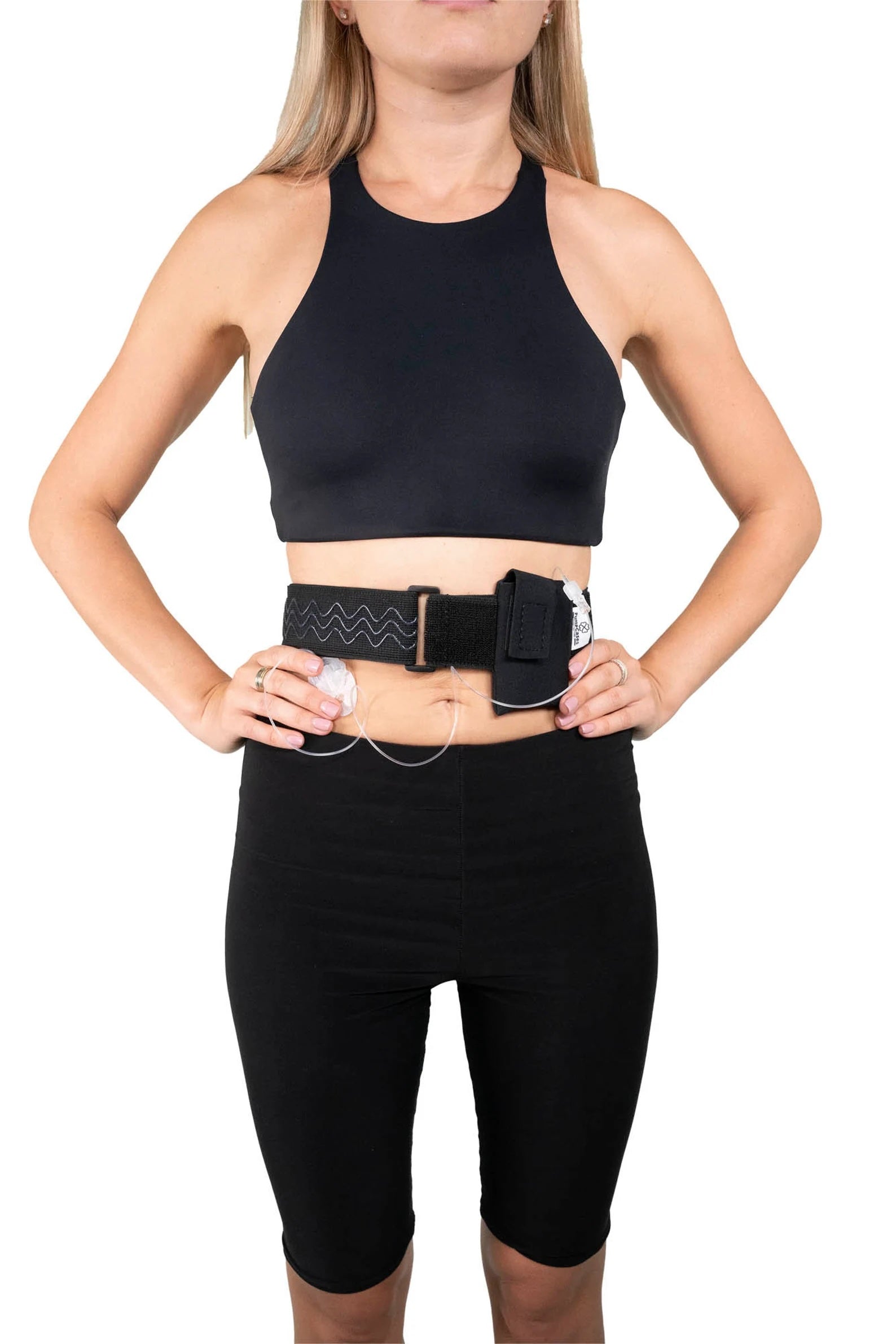 A woman wearing a Pumpcases black waist belt case on a white background.