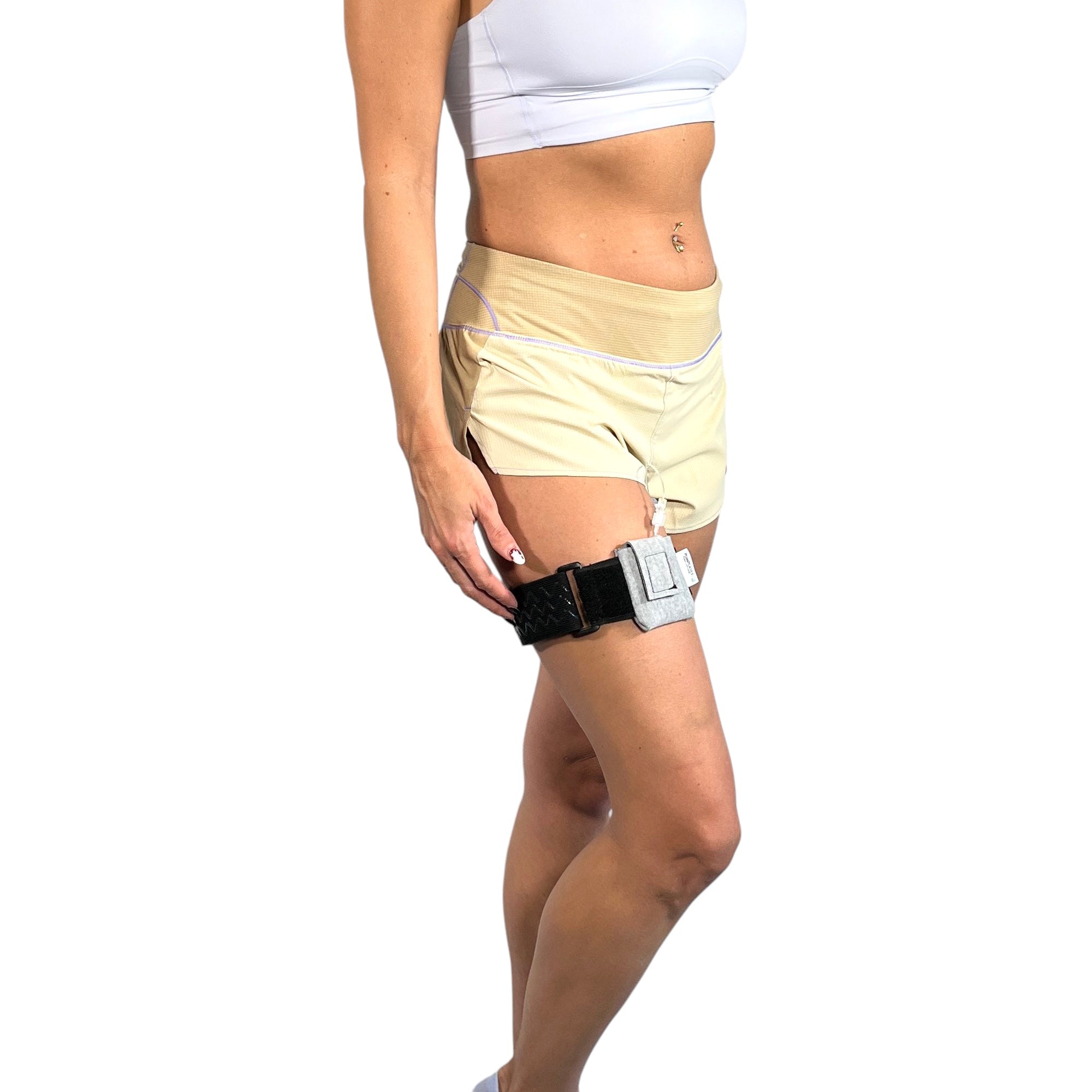 A woman wearing a Pumpcases heather gray Tandem Diabetes Mobi compatible thighband case.