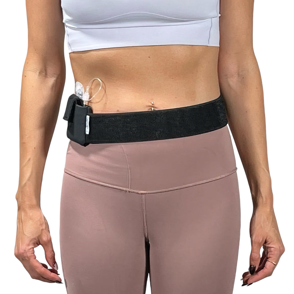 A woman wearing a Pumpcases Mobi black waist belt case on a white background.
