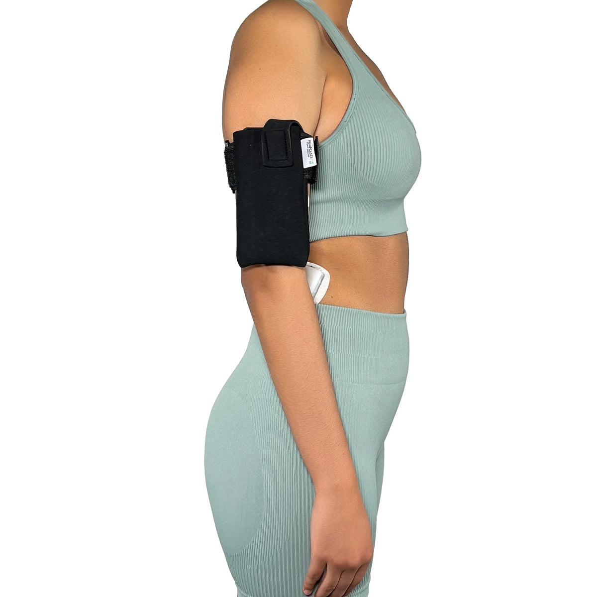A woman wearing a Pumpcases Omnipod 5 PDM black armband case on a white background.